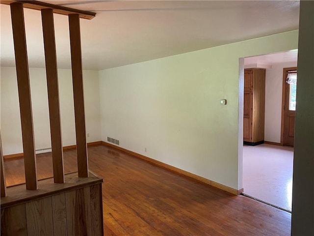 327 Craig St, Manor Twp, PA 16226 - unfurnished living room with baseboard heating, wood finished floors, and baseboards