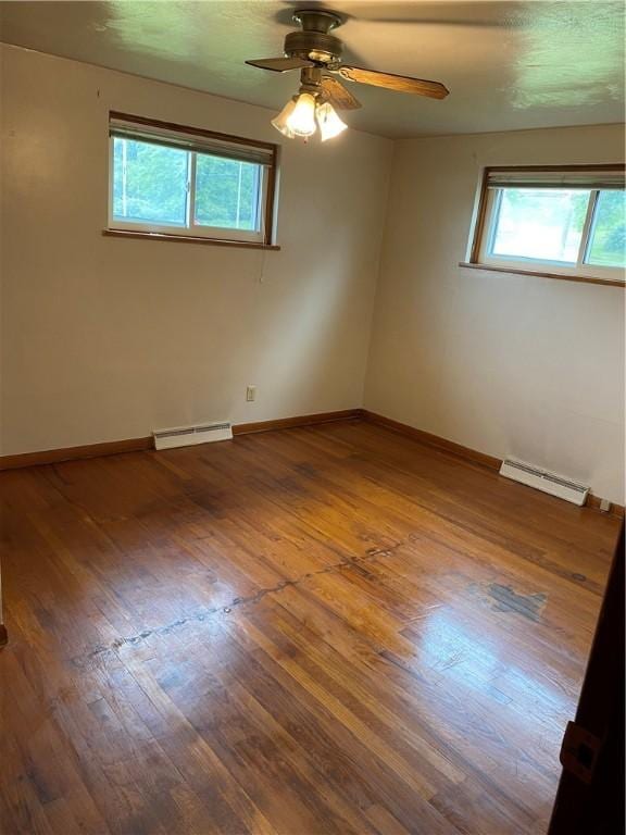 327 Craig St, Manor Twp, PA 16226 - spare room with baseboard heating, wood finished floors, and ceiling fan