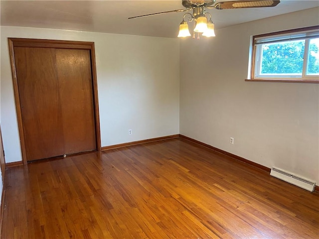 327 Craig St, Manor Twp, PA 16226 - spare room with a baseboard radiator, ceiling fan, and wood finished floors