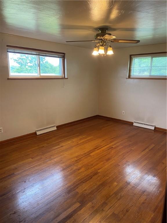 327 Craig St, Manor Twp, PA 16226 - spare room with a baseboard radiator, a ceiling fan, and plenty of natural light