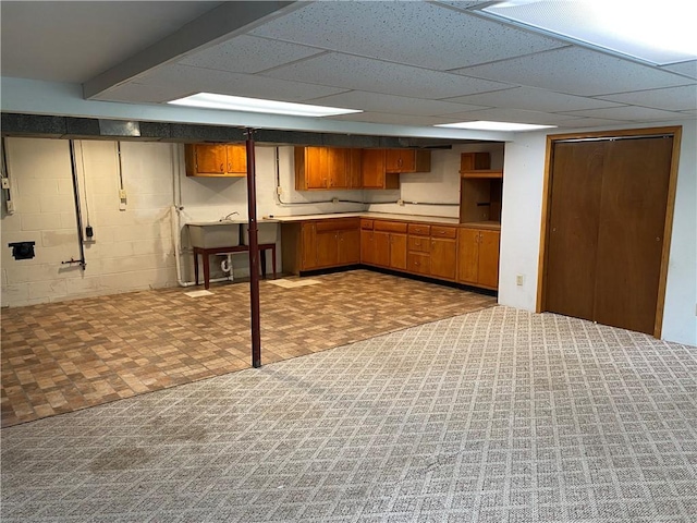 327 Craig St, Manor Twp, PA 16226 - kitchen with brown cabinetry, light countertops, a drop ceiling, and a sink
