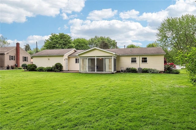 96 Concord Rd, Hermitage, PA 16148 - rear view of property featuring a sunroom, a lawn, and central AC unit