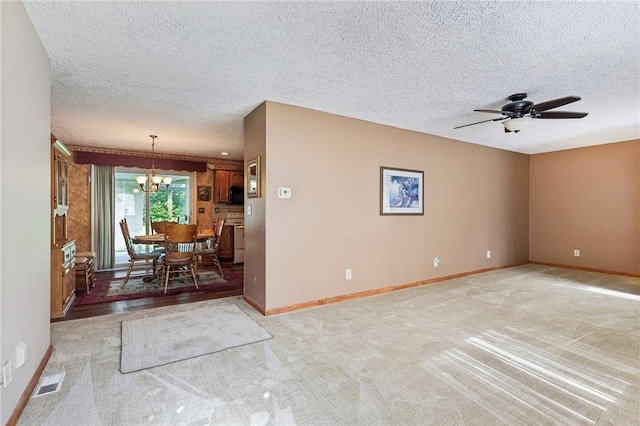 96 Concord Rd, Hermitage, PA 16148 - empty room with a chandelier, a textured ceiling, baseboards, ceiling fan, and light carpet