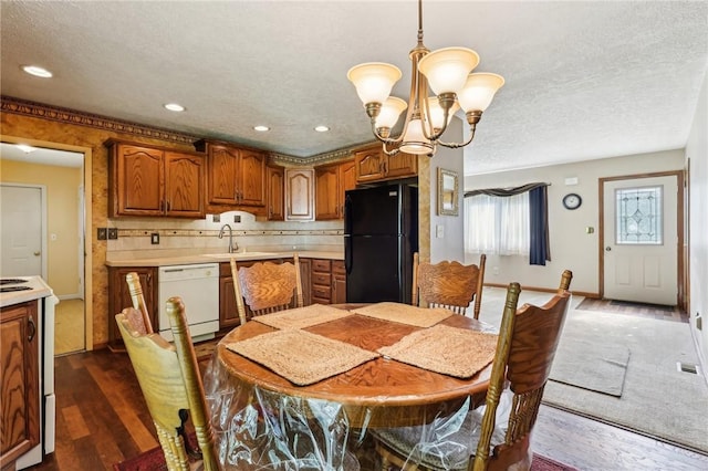 96 Concord Rd, Hermitage, PA 16148 - dining area with a chandelier, dark wood-type flooring, a textured ceiling, and recessed lighting
