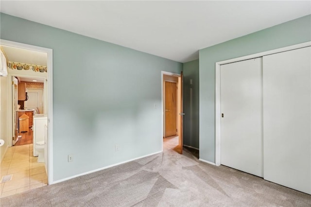96 Concord Rd, Hermitage, PA 16148 - unfurnished bedroom with a closet, connected bathroom, light carpet, and baseboards