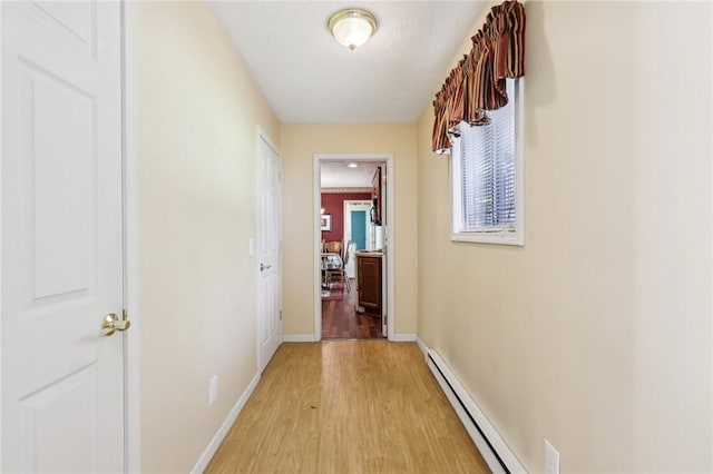 96 Concord Rd, Hermitage, PA 16148 - corridor with a baseboard heating unit, light wood-style floors, and baseboards