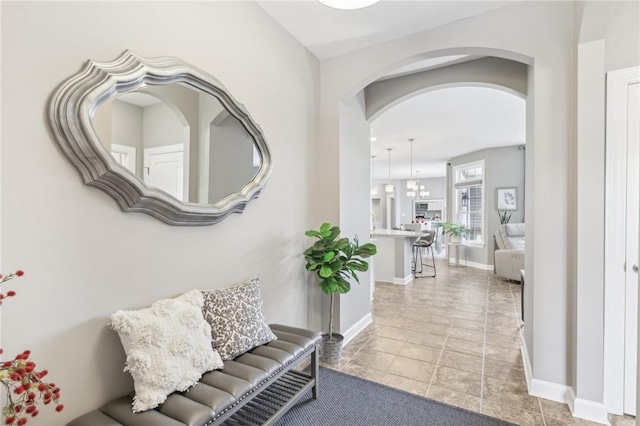 219 Brookside Dr, Cranberry Twp, PA 16066 - corridor with arched walkways, light tile patterned floors, and baseboards