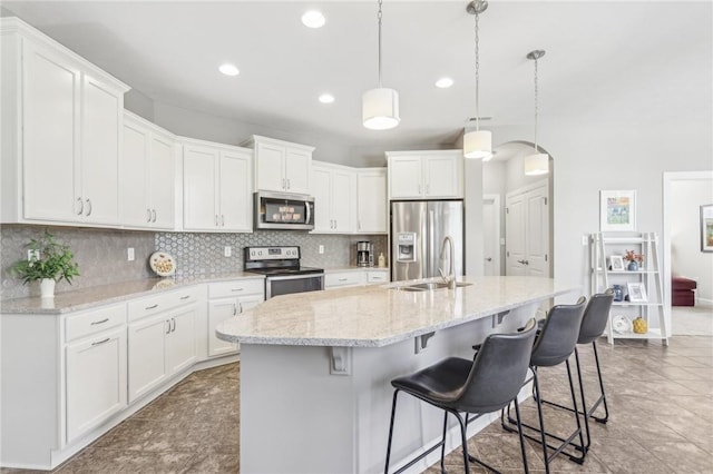 219 Brookside Dr, Cranberry Twp, PA 16066 - kitchen featuring appliances with stainless steel finishes, a sink, backsplash, white cabinets, and recessed lighting