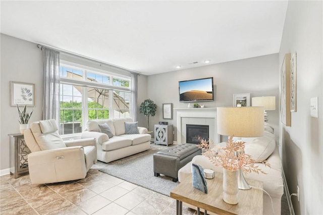 219 Brookside Dr, Cranberry Twp, PA 16066 - living room with a glass covered fireplace and light tile patterned floors