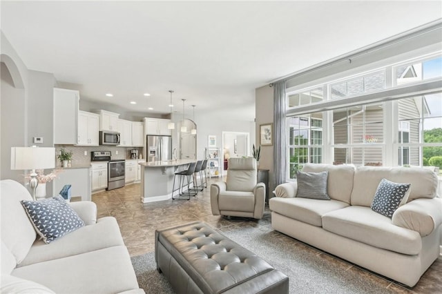 219 Brookside Dr, Cranberry Twp, PA 16066 - living area featuring plenty of natural light, recessed lighting, and arched walkways
