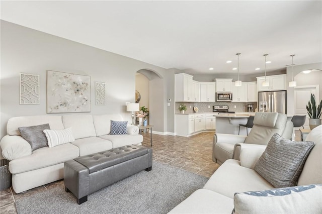 219 Brookside Dr, Cranberry Twp, PA 16066 - living area with arched walkways, recessed lighting, and baseboards