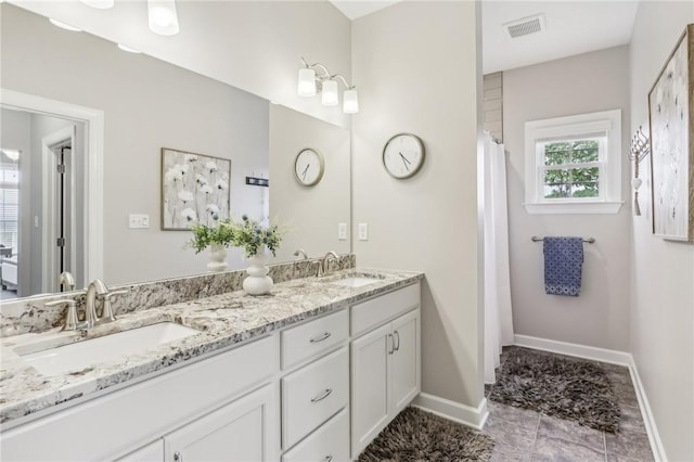 219 Brookside Dr, Cranberry Twp, PA 16066 - full bathroom with double vanity, baseboards, and curtained shower
