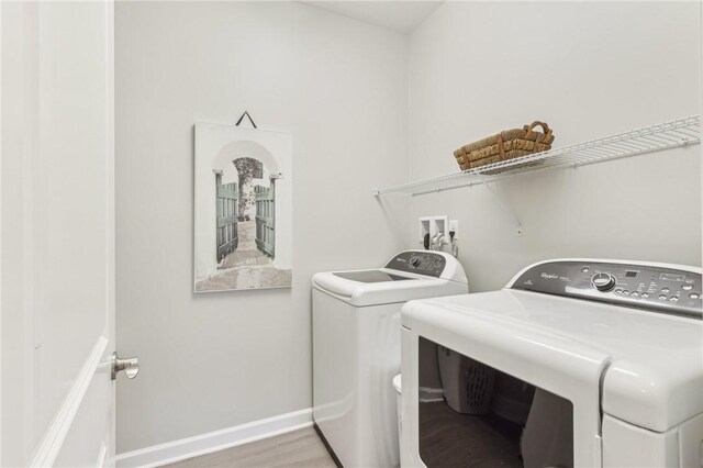219 Brookside Dr, Cranberry Twp, PA 16066 - laundry area featuring independent washer and dryer, wood finished floors, and baseboards