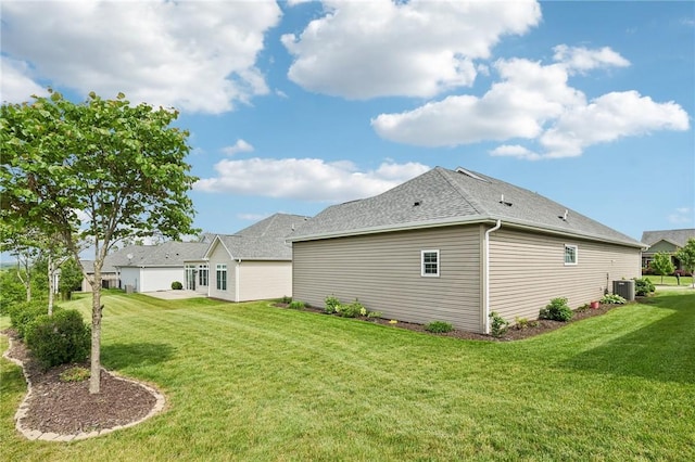 219 Brookside Dr, Cranberry Twp, PA 16066 - rear view of property featuring a yard, cooling unit, and a shingled roof
