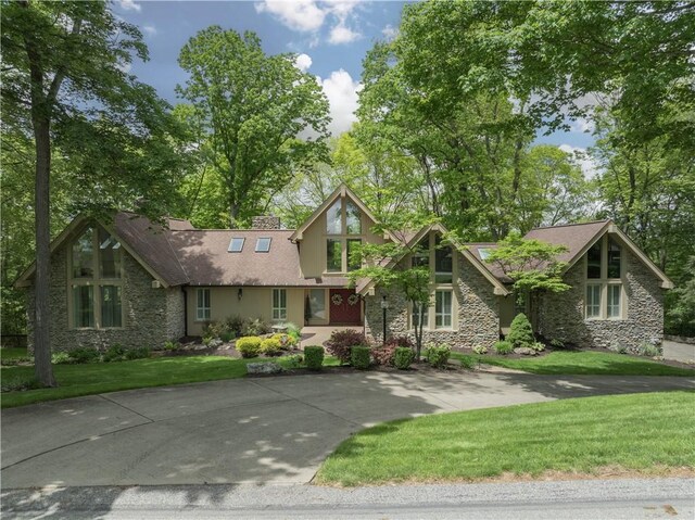 504 Timber Ln, Jefferson Hills, PA 15025 - view of front of home with stone siding and a front lawn