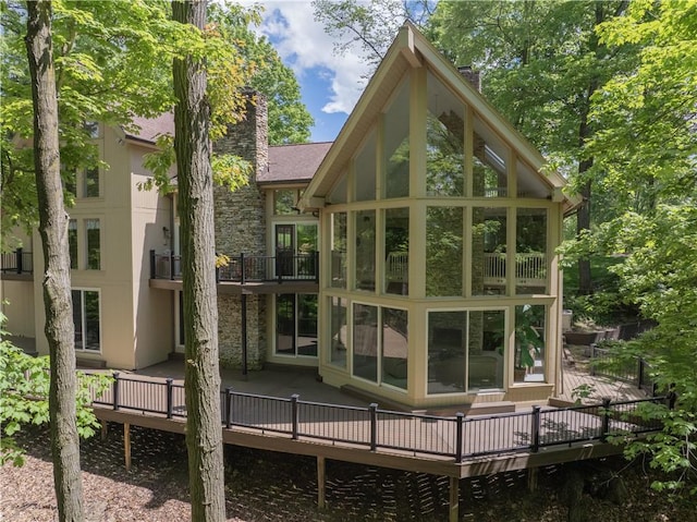 504 Timber Ln, Jefferson Hills, PA 15025 - rear view of property with a chimney, a balcony, a deck, and a sunroom