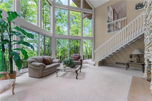 504 Timber Ln, Jefferson Hills, PA 15025 - living room with carpet flooring, a towering ceiling, and stairway