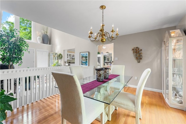 504 Timber Ln, Jefferson Hills, PA 15025 - dining space with a chandelier, hardwood / wood-style floors, and baseboards