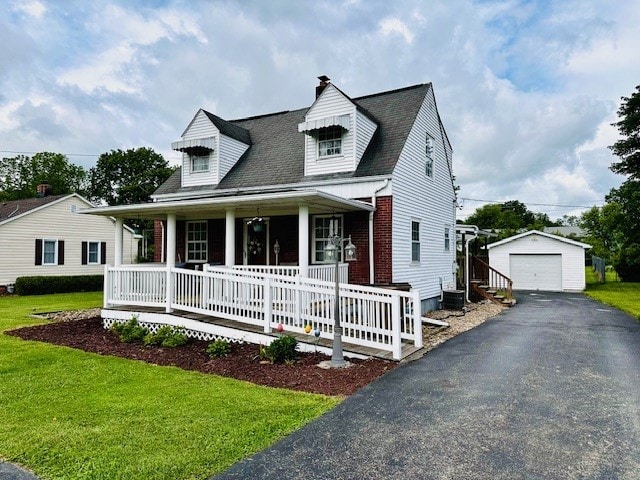 378 Ceylon Rd, Carmichaels/Cumblnd, PA 15320 - cape cod house featuring a porch, a detached garage, an outdoor structure, and a front yard