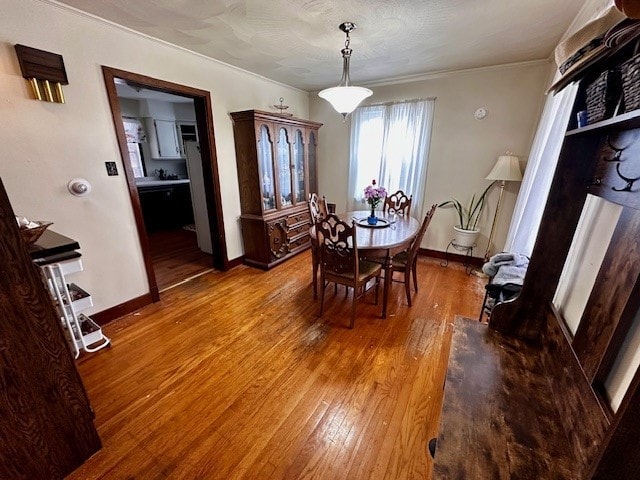 378 Ceylon Rd, Carmichaels/Cumblnd, PA 15320 - dining room featuring hardwood / wood-style floors, ornamental molding, and baseboards