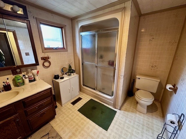 378 Ceylon Rd, Carmichaels/Cumblnd, PA 15320 - bathroom with vanity, a shower stall, tile walls, toilet, and ornamental molding