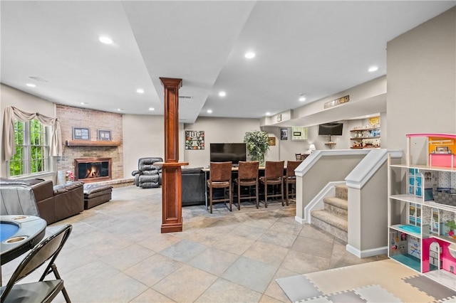 110 Marcur Ln, Center Twp Bea, PA 15061 - living room with ornate columns, recessed lighting, a brick fireplace, and bar