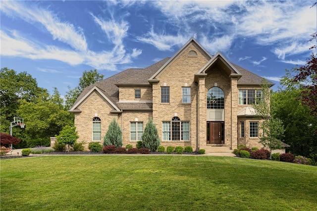 110 Marcur Ln, Center Twp Bea, PA 15061 - view of front of home with a front yard, brick siding, and roof with shingles