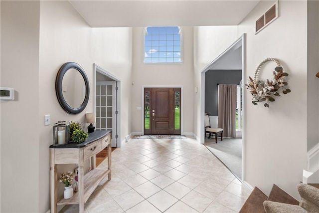 110 Marcur Ln, Center Twp Bea, PA 15061 - foyer with light tile patterned flooring, a towering ceiling, baseboards, and stairway