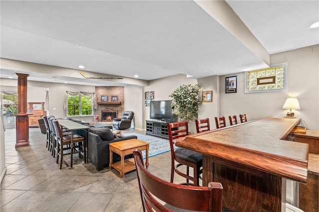 110 Marcur Ln, Center Twp Bea, PA 15061 - living room with ornate columns, recessed lighting, a large fireplace, and a bar