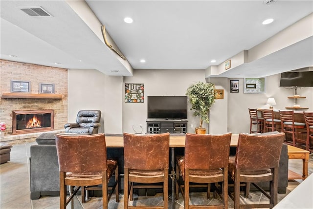 110 Marcur Ln, Center Twp Bea, PA 15061 - dining room featuring recessed lighting, a brick fireplace, and bar area