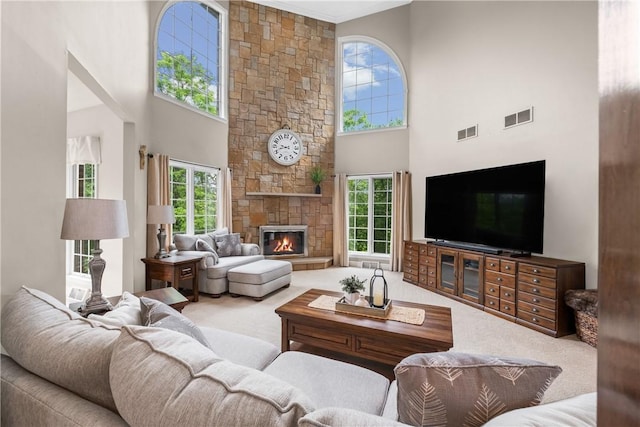 110 Marcur Ln, Center Twp Bea, PA 15061 - living area with carpet flooring, a high ceiling, and a stone fireplace