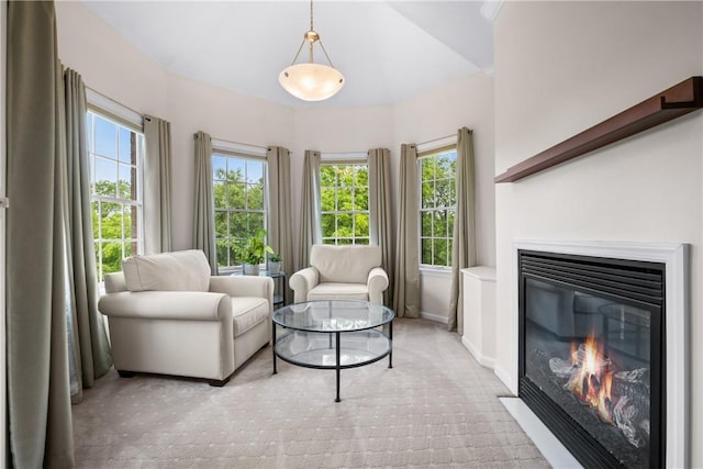 110 Marcur Ln, Center Twp Bea, PA 15061 - living area featuring a glass covered fireplace, light carpet, and baseboards