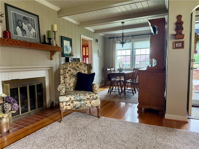 411 Harrison W, Kittanning Boro, PA 16201 - living room with wood finished floors, a fireplace, beam ceiling, a chandelier, and baseboards