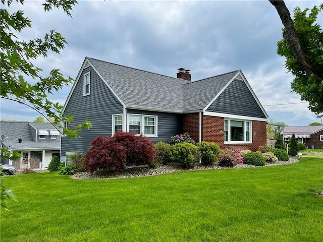 411 Harrison W, Kittanning Boro, PA 16201 - view of side of property with a shingled roof, a lawn, a chimney, and brick siding