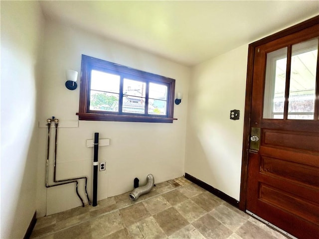 301 4th St, Luzerne Twp, PA 15413 - laundry room featuring hookup for a washing machine, stone finish flooring, and baseboards