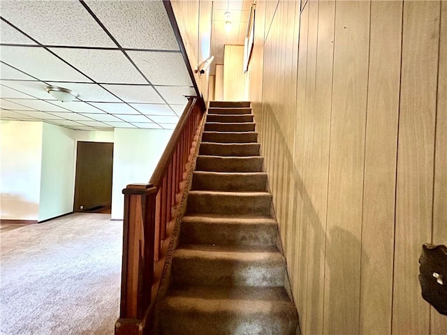 301 4th St, Luzerne Twp, PA 15413 - staircase featuring carpet flooring and wood walls