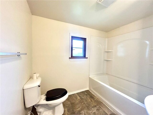301 4th St, Luzerne Twp, PA 15413 - bathroom with toilet, baseboards, and shower / tub combination