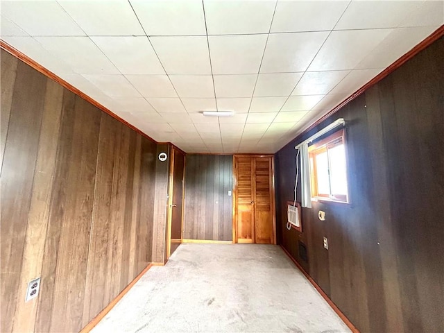 301 4th St, Luzerne Twp, PA 15413 - spare room featuring wood walls and light colored carpet
