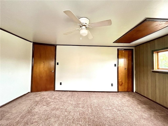 301 4th St, Luzerne Twp, PA 15413 - carpeted spare room featuring ceiling fan, baseboards, and wood walls