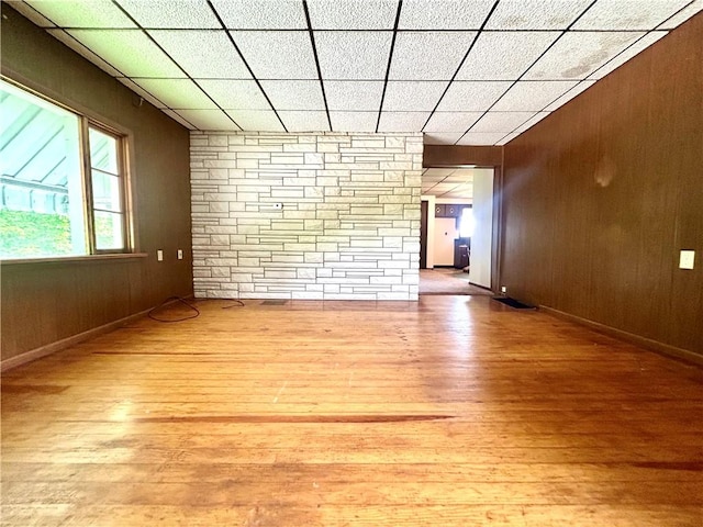 301 4th St, Luzerne Twp, PA 15413 - spare room with wood finished floors, wood walls, and baseboards
