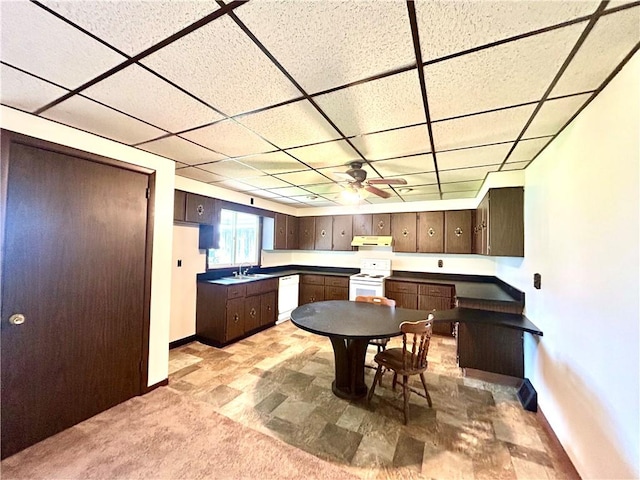 301 4th St, Luzerne Twp, PA 15413 - kitchen featuring white appliances, a sink, baseboards, under cabinet range hood, and a paneled ceiling