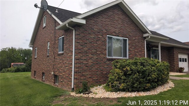 175 Sherman Ave, Waynsbrg/Frankln Twp, PA 15370 - view of side of property featuring brick siding, a garage, and a lawn