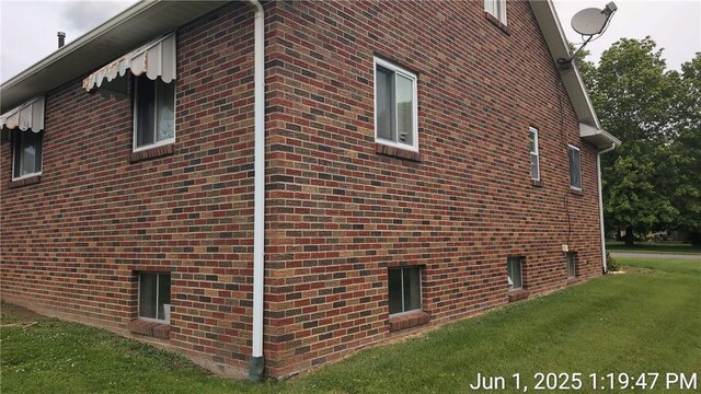 175 Sherman Ave, Waynsbrg/Frankln Twp, PA 15370 - view of side of home featuring brick siding and a lawn