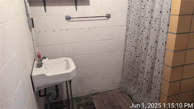 175 Sherman Ave, Waynsbrg/Frankln Twp, PA 15370 - bathroom featuring a shower with shower curtain and concrete block wall