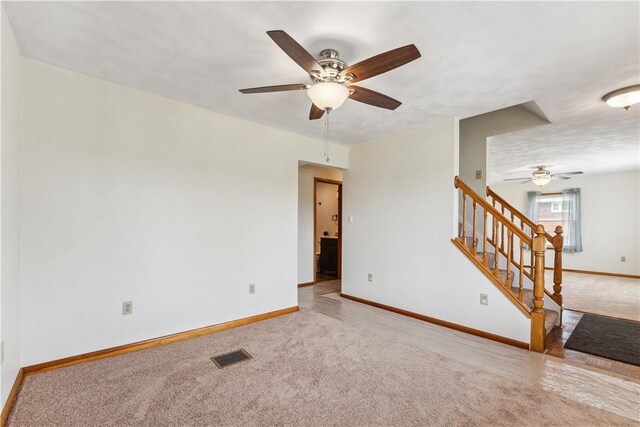 207 Mccartney Dr, Moon/Crescent Twp, PA 15108 - carpeted empty room with a ceiling fan, baseboards, and stairs