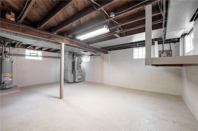 207 Mccartney Dr, Moon/Crescent Twp, PA 15108 - basement with water heater, heating unit, and plenty of natural light