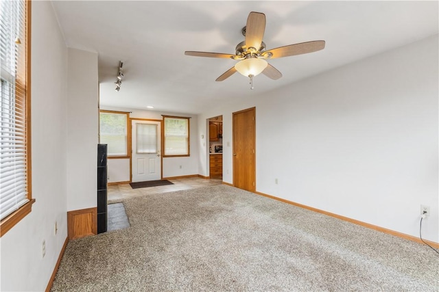 207 Mccartney Dr, Moon/Crescent Twp, PA 15108 - unfurnished living room featuring light colored carpet, baseboards, and a ceiling fan