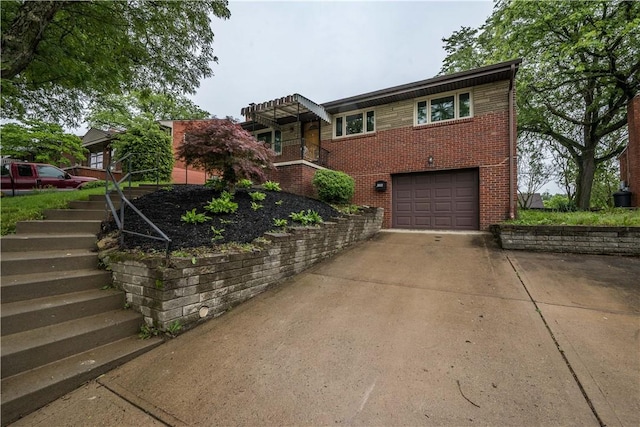 126 Woodhall Dr, Baldwin Boro, PA 15236 - view of front facade featuring stairway, concrete driveway, brick siding, and an attached garage