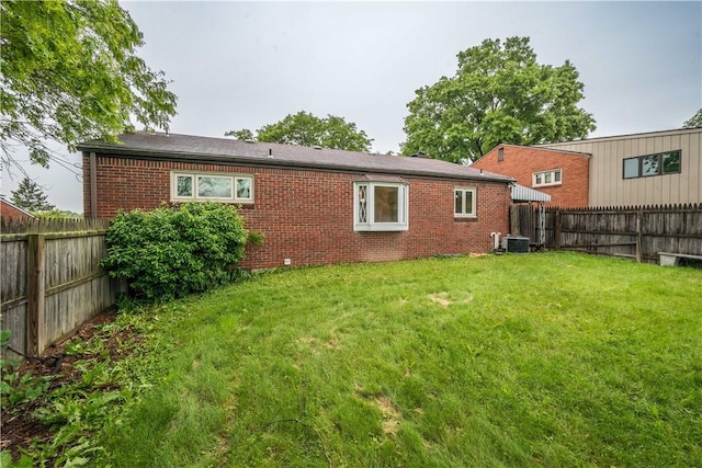 126 Woodhall Dr, Baldwin Boro, PA 15236 - rear view of property featuring brick siding and central AC unit