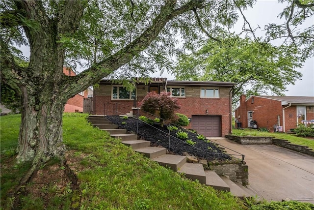 126 Woodhall Dr, Baldwin Boro, PA 15236 - ranch-style home featuring driveway, brick siding, a garage, and stairs